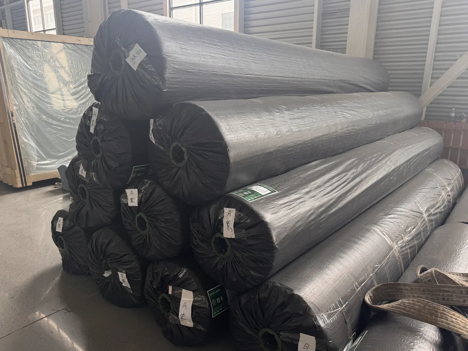 Large padel court rolls wrapped and labeled for export packing